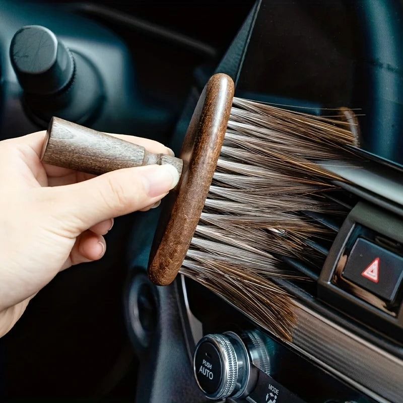 Walnut Wood Grinder Cleaning Brush being used to sweep debris from a coffee grinder's burr chamber