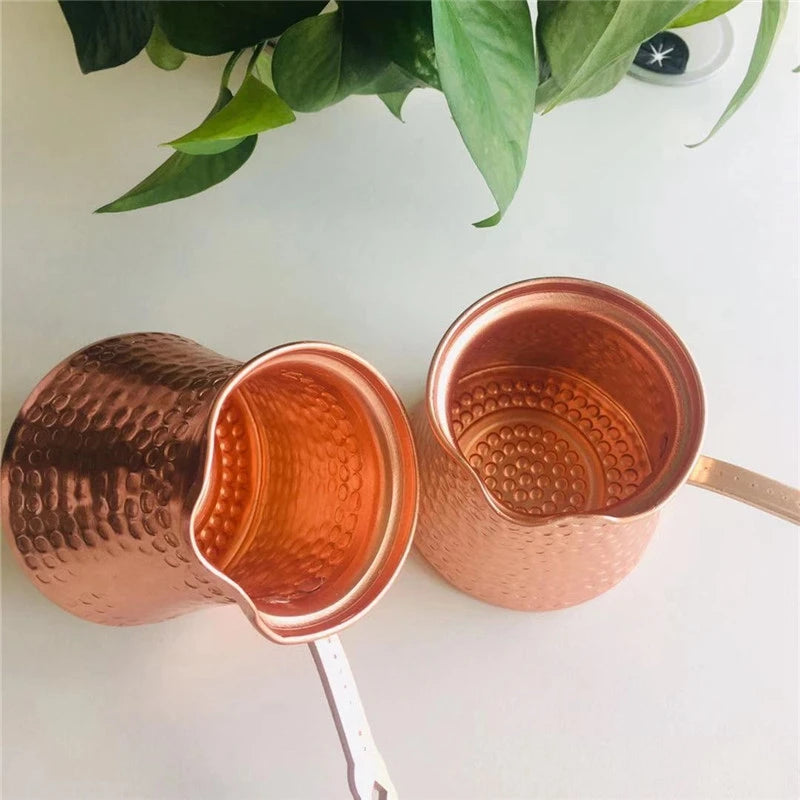 Copper Turkish Coffee Cezve with burnished patina and traditional spout, displayed against neutral background showing craftsmanship details