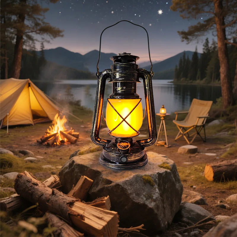 USB Rechargeable Retro Camp Lantern with brass accents and warm LED glow, front view against neutral background