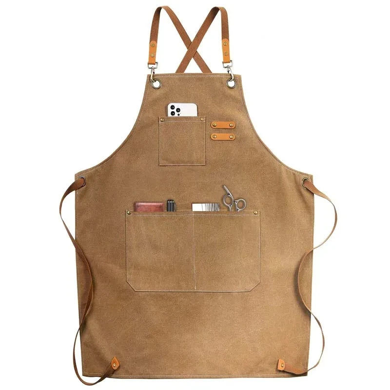Waxed Canvas Barista Apron laid flat showing full front panel with leather straps and utility pockets
