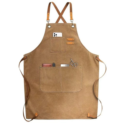Waxed Canvas Barista Apron laid flat showing full front panel with leather straps and utility pockets