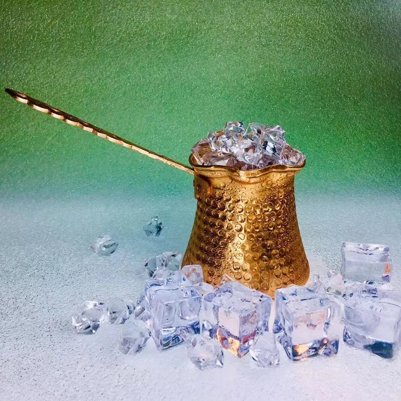 Copper Turkish Coffee Cezve displayed at an angle showing the long handle and traditional tapered body design