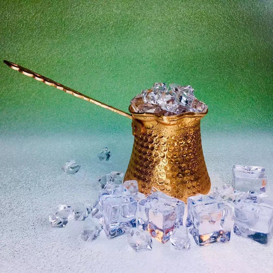 Copper Turkish Coffee Cezve displayed at an angle showing the long handle and traditional tapered body design