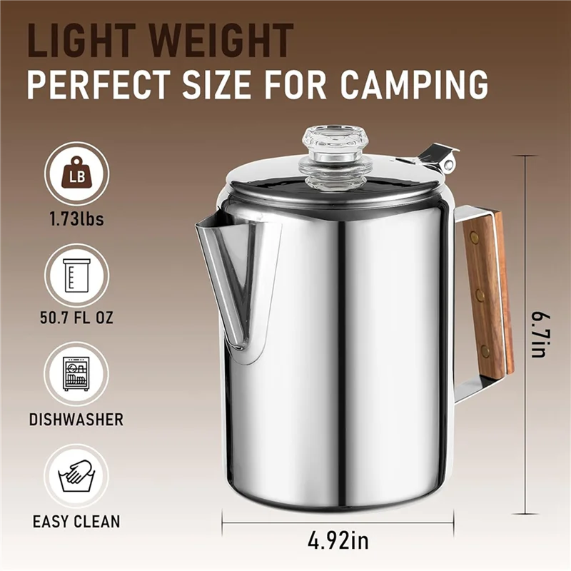 Heritage Stainless Steel Camp Percolator sitting on a campfire grate with steam rising from the spout, surrounded by camping gear